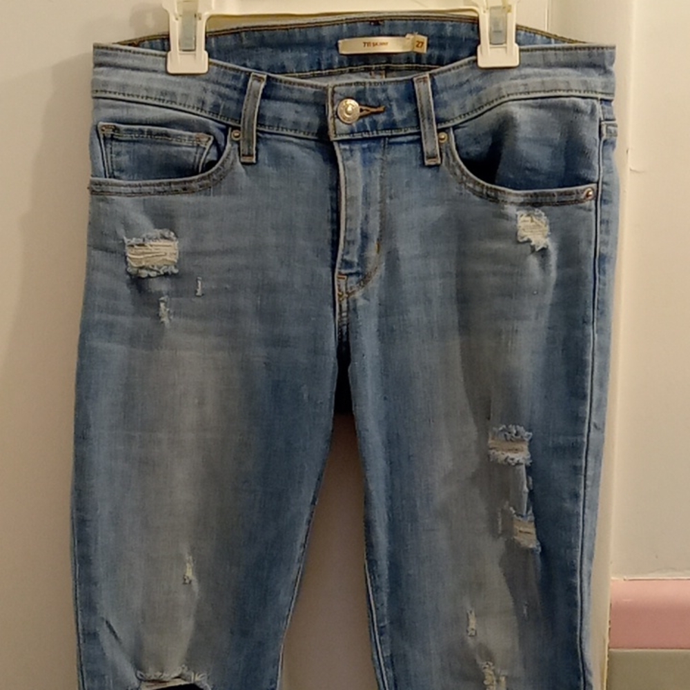 Levi Strauss 711 Skinny Destressed Jeans. Size 27, light wash color.